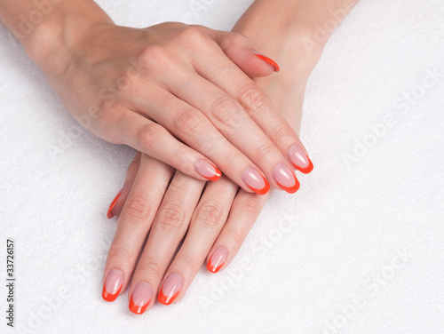 Hands with french manicure lying down
