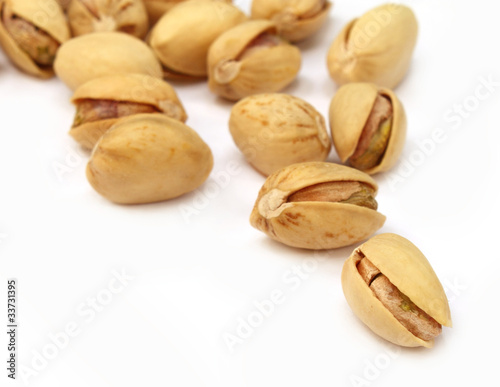 Pistachios isolated over white background