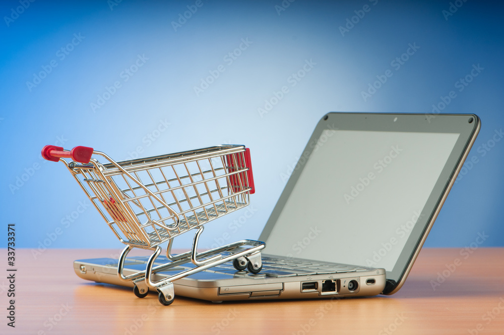 Internet online shopping concept with computer and cart