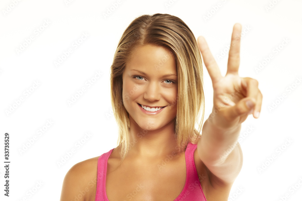 happy excited young woman showing the sign of victory happy excited young woman showing the sign of victory