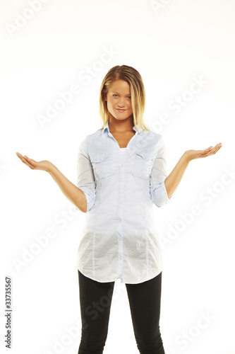 Young attractive woman holds palm for blank ad space