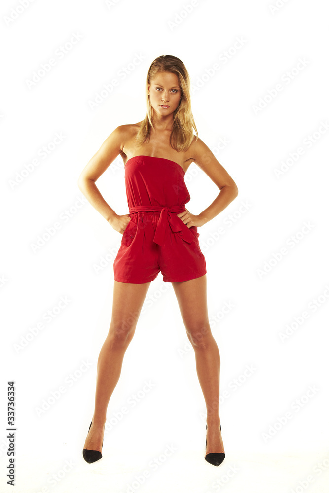 Young teen woman wearing a red dress posing Young teen woman wearing a red dress posing
