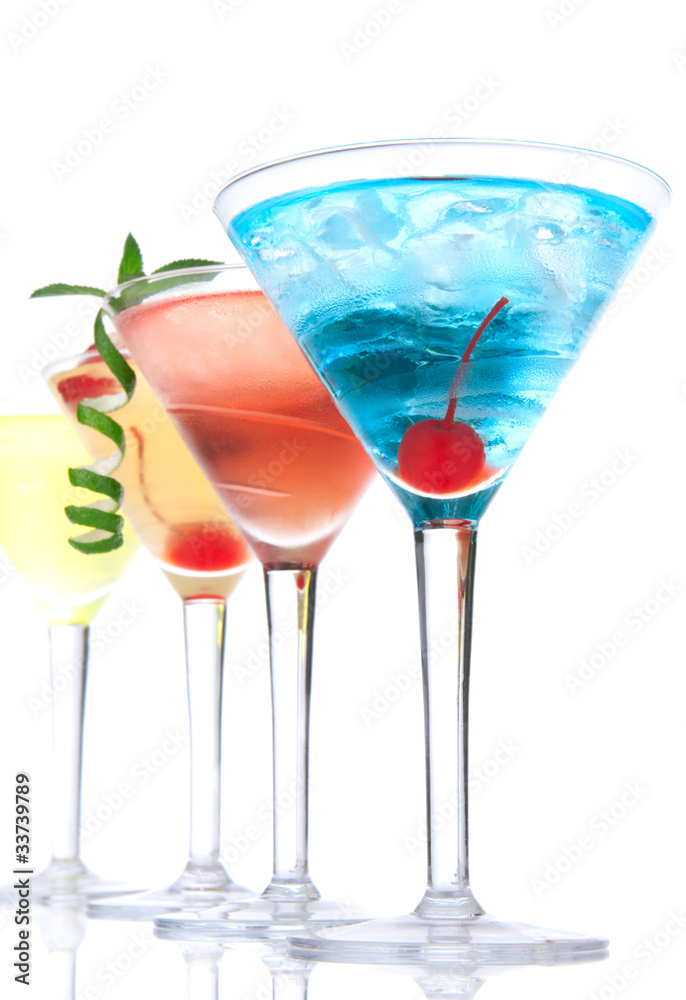 Martini alcohol cocktails in row  blue hawaiian, tequila sunrise