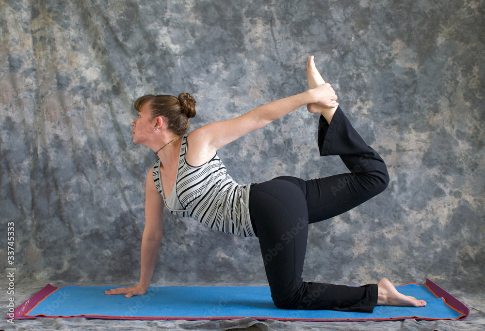 Pregnant woman enjoys exercising yoga,Vyaghrasana-Tiger Pose Stock Photo -  Alamy