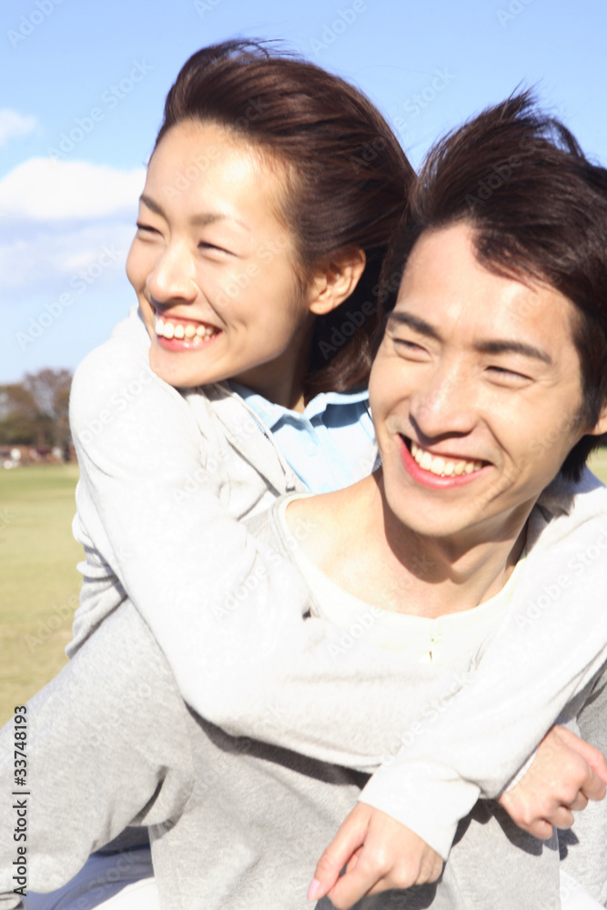 彼女をおんぶする男性 Stock Photo Adobe Stock