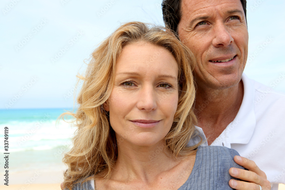 Closeup of couple on the beach, man looking to the sky Closeup of couple on the beach, man looking to the sky