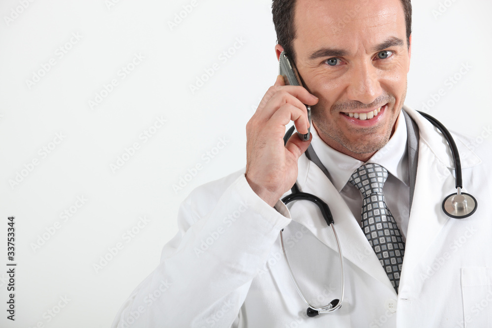 Doctor on phone smiling Doctor on phone smiling