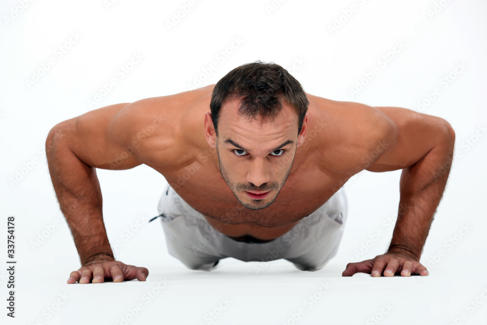 A man doing push-ups A man doing push-ups
