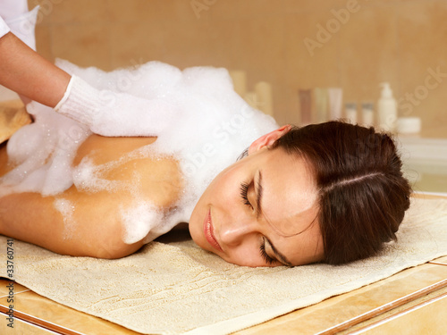 Massage of woman in beauty spa. photo
