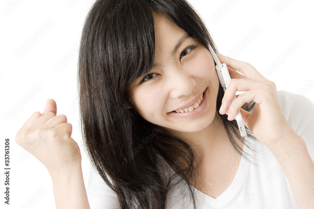 電話とガッツポーズの女性 電話とガッツポーズの女性