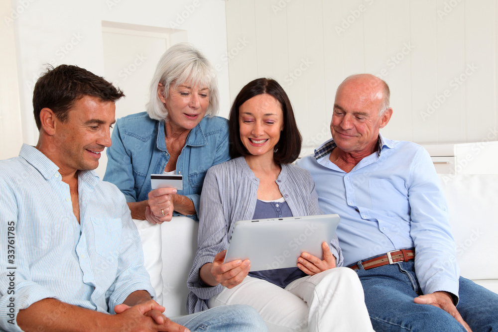 Senior people with couple doing shopping online Senior people with couple doing shopping online