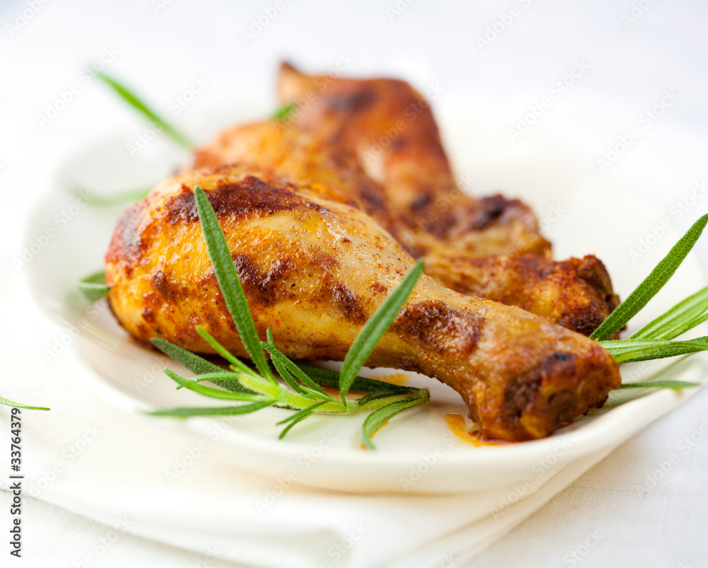 Roasted chicken legs with rosemary sprigs Roasted chicken legs with rosemary sprigs
