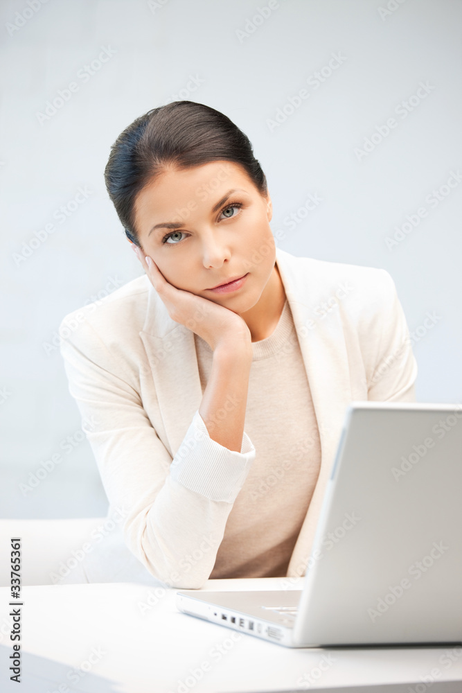 pensive woman with laptop computer pensive woman with laptop computer