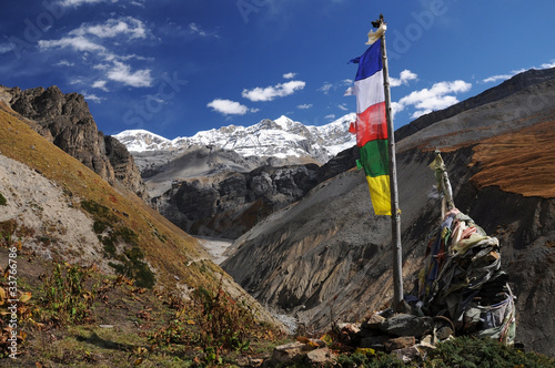Peak with colorful prayer flags, Himalaya, Nepal