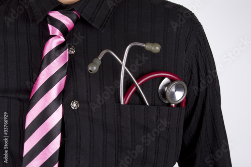 doctor wear black shirt pink tie with stethoscope in pocket.