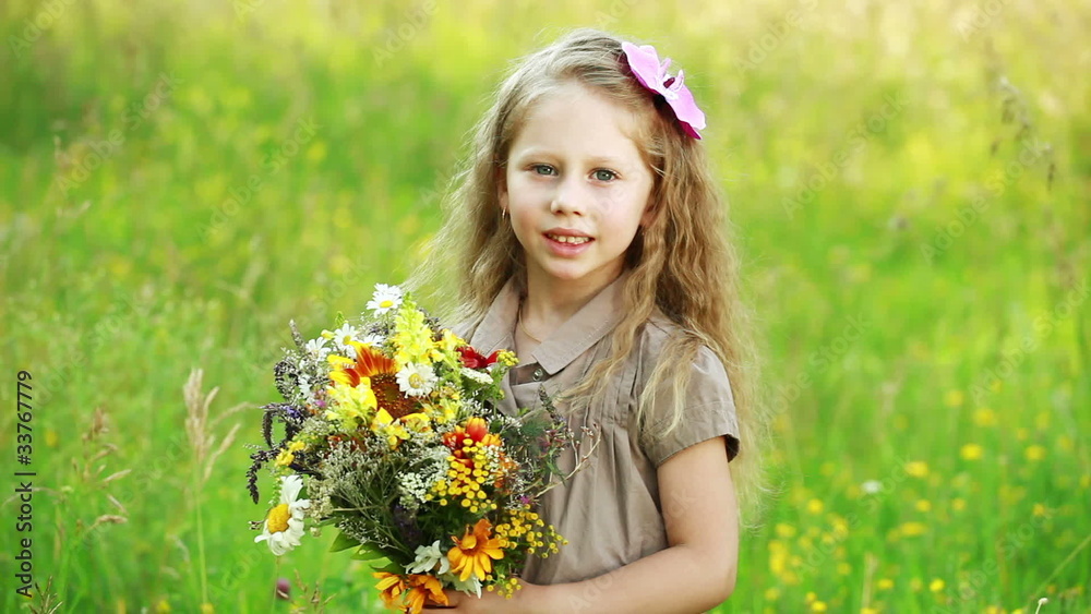 Girl with flowers loking at camera Girl with flowers loking at camera