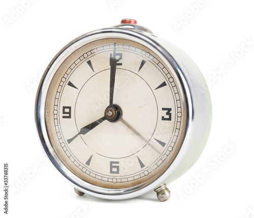Old retro alarm clock isolated
