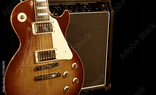 Electric Guitar With Amplifier Isolated on Black Background