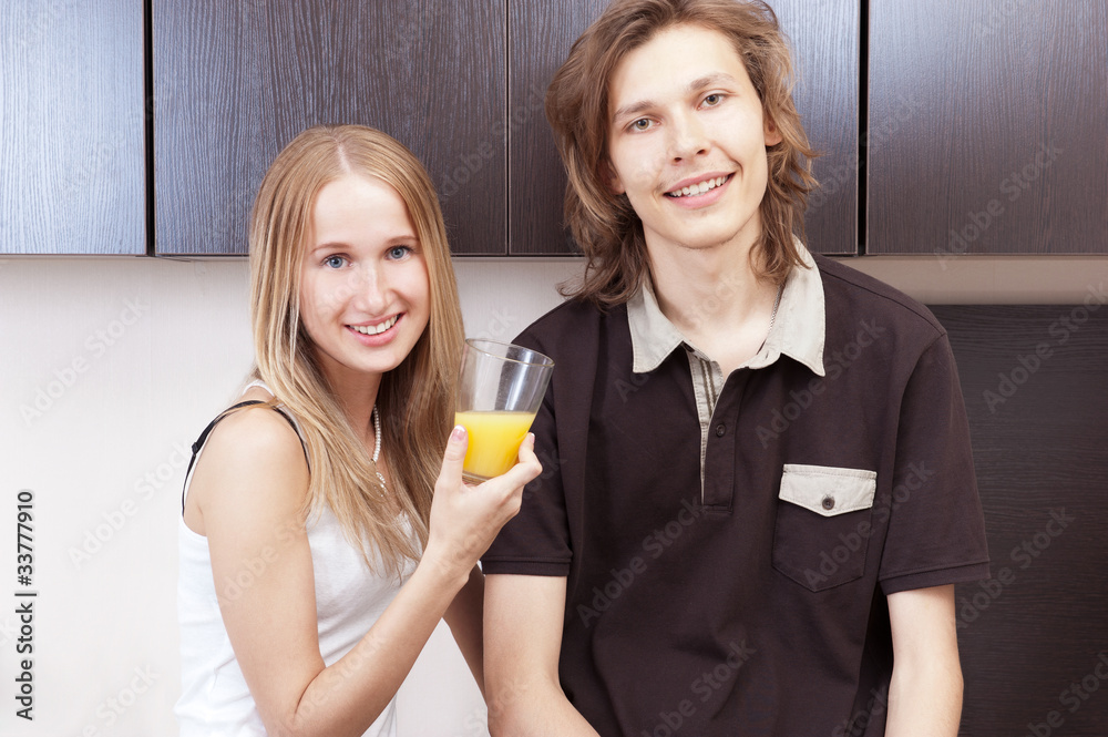 Playful young couple in their kitchen. Playful young couple in their kitchen.