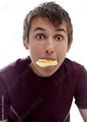 Boy mouthful potato chips