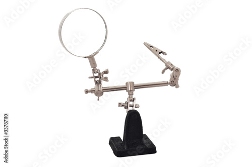 Magnifying glass with a clamp on the stand on a white background