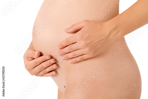 Pregnant woman is holding her belly body part