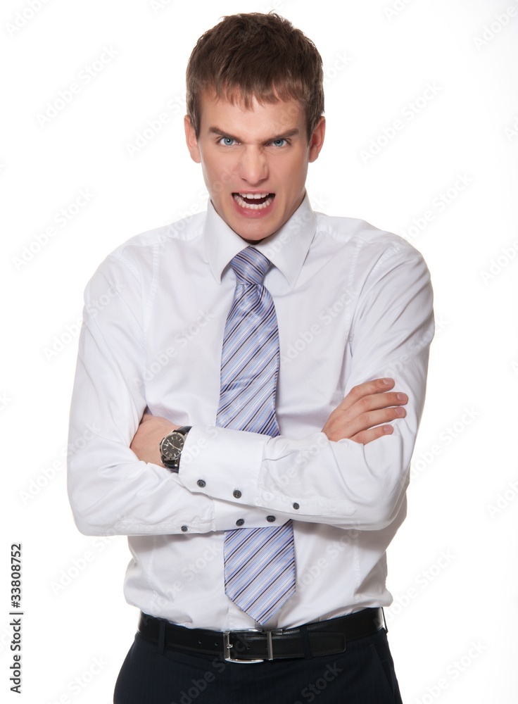 Angry young businessman isolated on white