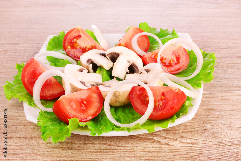 many vegetables on the plate on a wooden background many vegetables on the plate on a wooden background