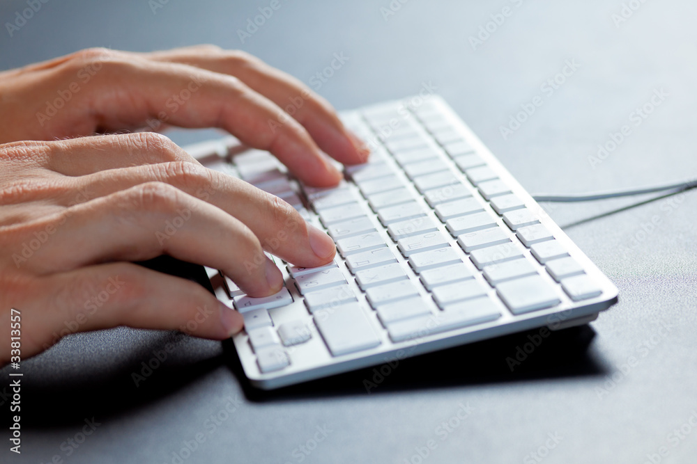 Hands typing on a keyboard. Hands typing on a keyboard.