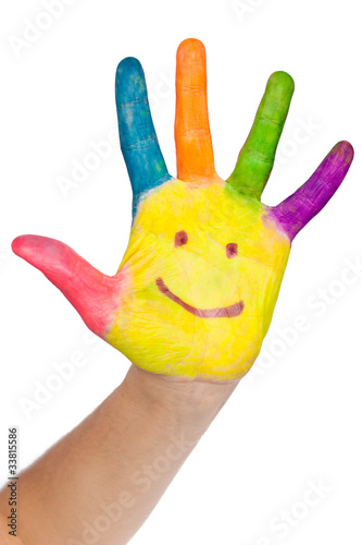 Colored hand with smile painted in colorful paints