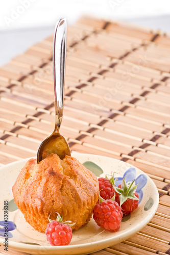 Cake with raspberry and spoon.