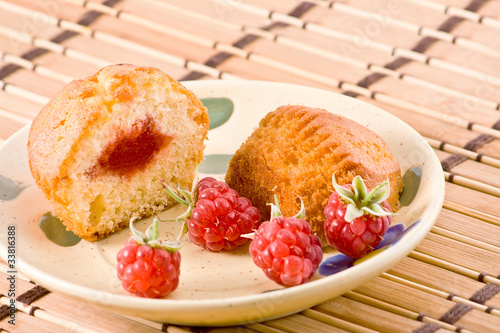 Cut cake with raspberry jam.