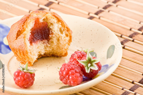 Bitten cake with raspberry jam.