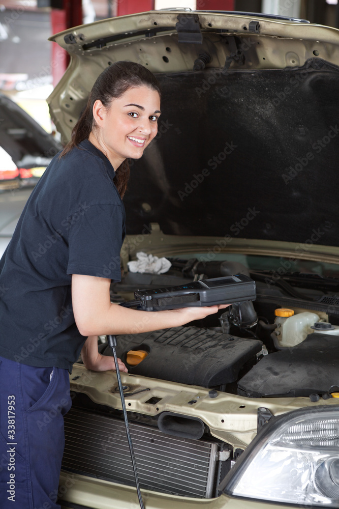 Happy Woman Mechanic with Diagnostic Tool Happy Woman Mechanic with Diagnostic Tool