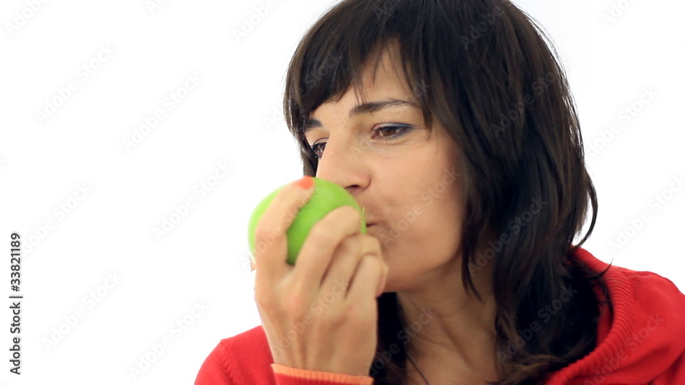 Attractive woman eating apple, isolated on white Attractive woman eating apple, isolated on white