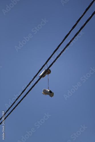Soccer Shoes hanging on Power Cable