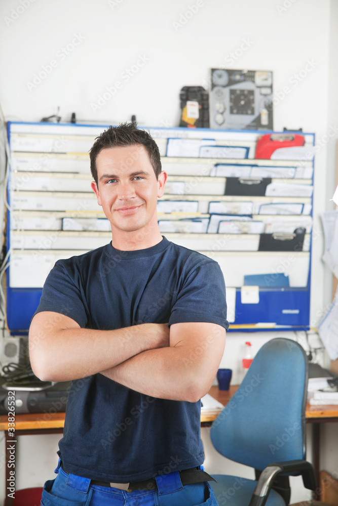 Handsome mechanic at auto repair shop Handsome mechanic at auto repair shop