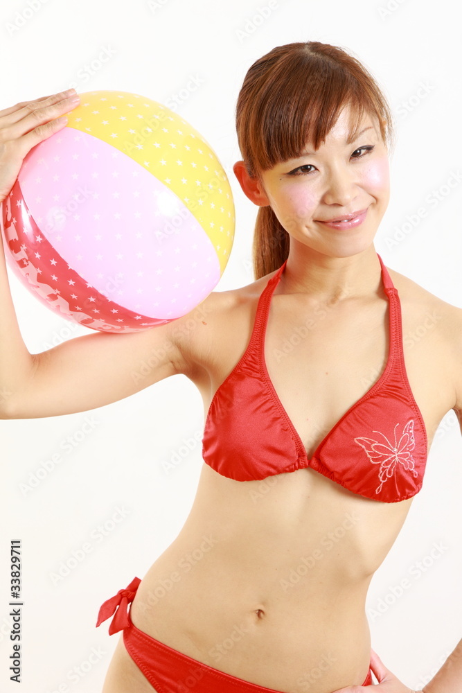 young japanese woman wearing bikini with beach ball Stock Photo | Adobe  Stock