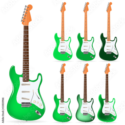 set of green electric guitars isolated on white background