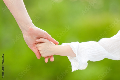 hands of mother and daughter © Konstantin Yolshin