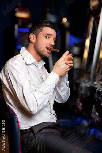 casino player smoking cigar