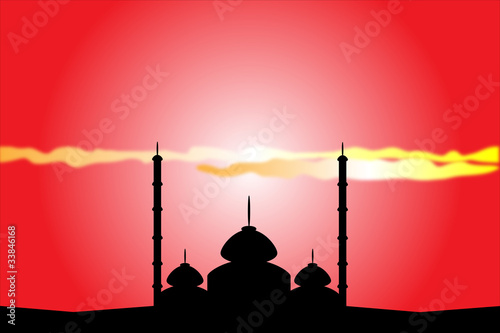 Silhouette of mosque at sunset