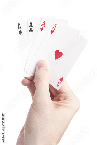 A hand holding playing cards