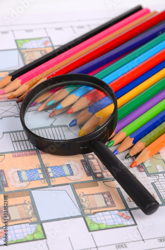 House plan,magnifier and color pencils