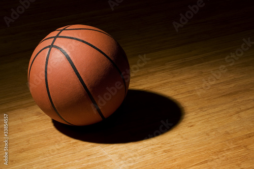 Basket ball sitting on wood floor