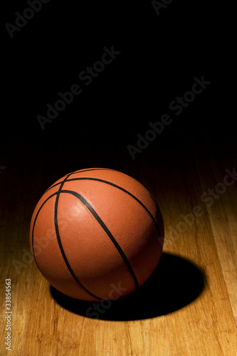 Basketball sitting on wood floor