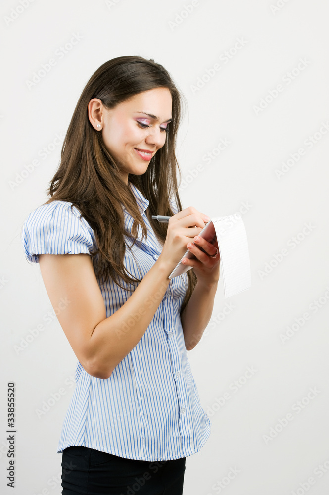 Business woman with notebook in the office Business woman with notebook in the office