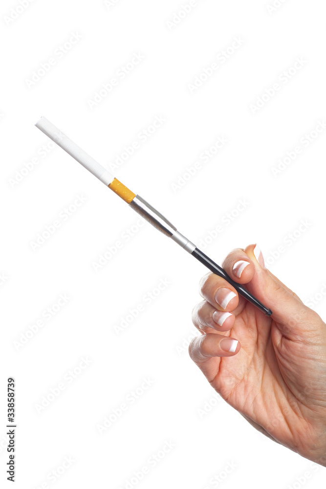 Woman’s hand with cigarette holder, isolated on white Woman’s hand with cigarette holder, isolated on white