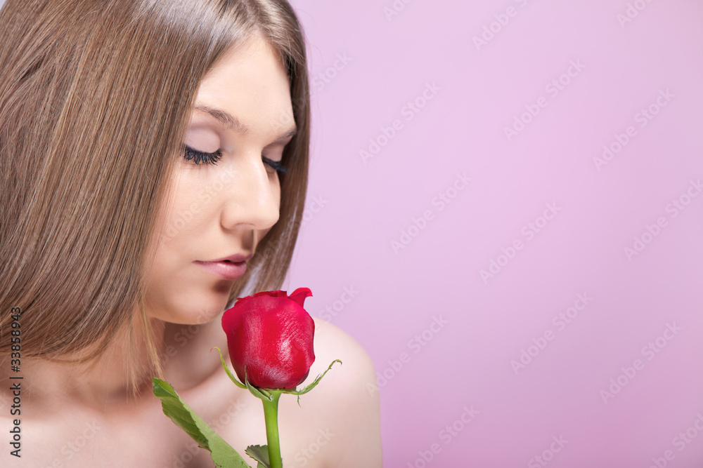 woman smelling rose woman smelling rose