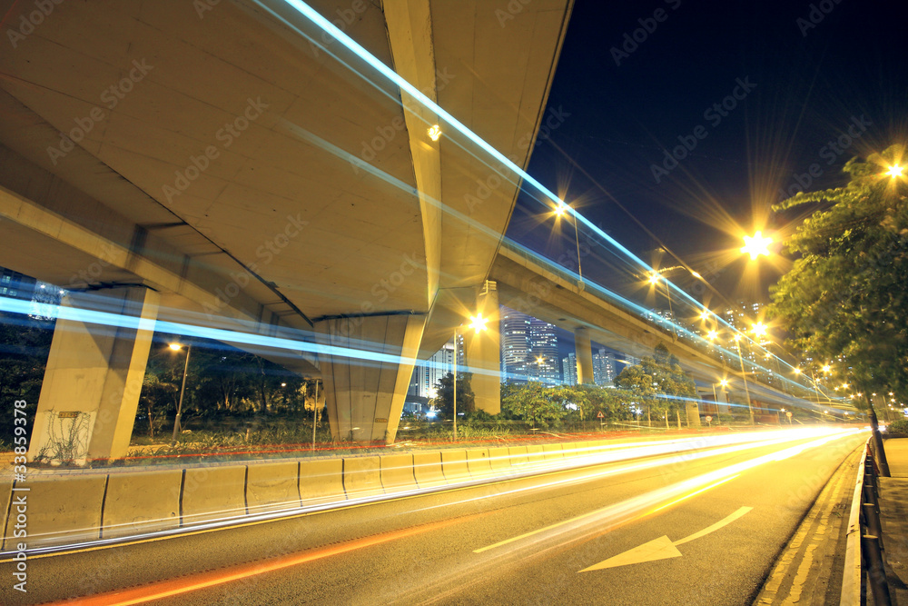Traffic through the city (traffic seen as trails of light) Traffic through the city (traffic seen as trails of light)